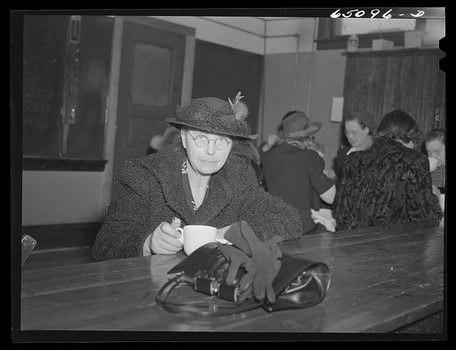 Epping, North Dakota. Lady having pie and coffee served by WCTU (Woman's Christian Temperance Union) after meeting held in high school to promote sale of defense stamps and bonds