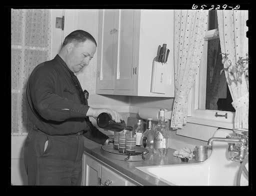 Kalispell, Montana. Howard Harper fixing drinks