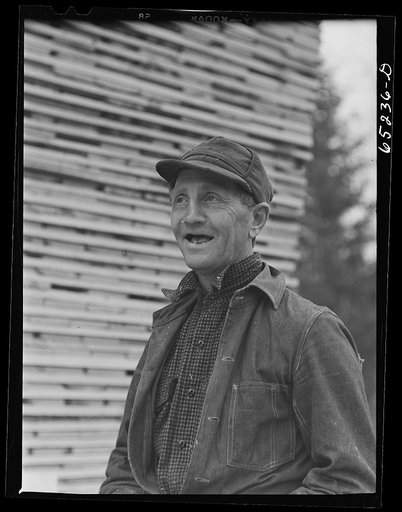 Untitled photo, possibly related to: Flathead Valley special area project, Montana. Stacking board lumber at the cooperative sawmill. This mill is operated by FSA (Farm Security Administration) borrowers, most of whom have moved to Flathead County in recent years from the drought area of eastern Mon