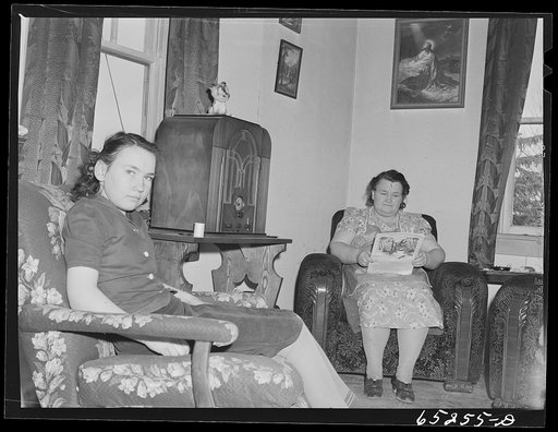 Untitled photo, possibly related to: Flathead Valley special area project, Montana. Mrs. James Doyle at her kitchen stove. The Doyles are FSA (Farm Security Administration) borrowers