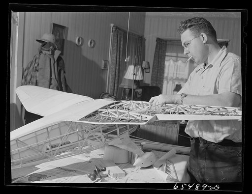 Untitled photo, possibly related to: Wisdom, Montana. Len Smith building a model airplane