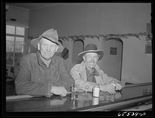 Hamilton, Montana. Sheep workers at the bar