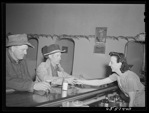 Untitled photo, possibly related to: Hamilton, Montana. Sheep workers at the bar