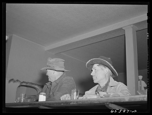 Untitled photo, possibly related to: Hamilton, Montana. Sheep workers at the bar