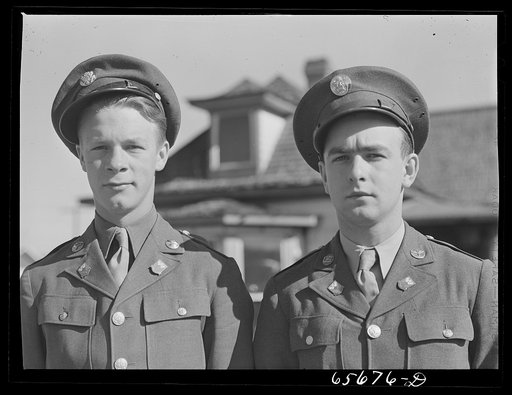 Soldiers from Fort Logan, Colorado hitchhiking along U.S. highway number forty