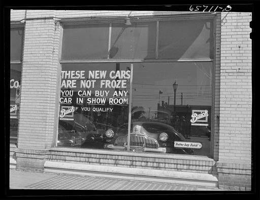 Grand Island, Nebraska. Auto dealer's window