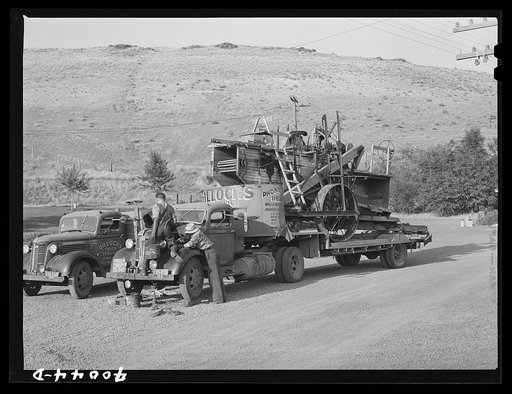 Truck used for transporting combine. Garfield County, Washington. Combines are often taken to town repair shops by this means and sometimes wheat farmers rent out or share combines