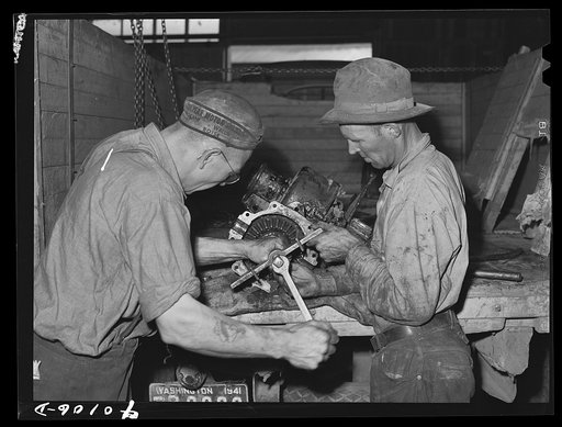 Repairing tractor, Colfax. Washington