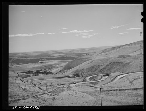 Highway leading down to the gorge at the Columbia River from the bench land. Klickitat County, Washington