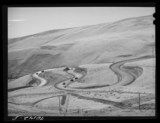 Highway leading down to the gorge at the Columbia River from the bench land. Klickitat County, Washington
