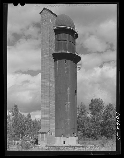 Grain elevator made from abandoned waste and sawdust burner at abandoned sawmill. Bonners Ferry, Idaho. At one time lumbering was first industry of this section, now cut-over farming ranks high