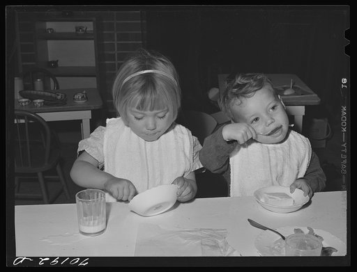 Children eat lunch at the nursery school at the FSA (Farm Security Administration) farm family migratory labor camp. Yakima, Washington