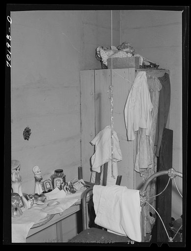 Bedroom in this house rented from Indian by FSA (Farm Security Administration) rehabilitation borrower is crowded and lacking in closet space. Yakima County, Washington