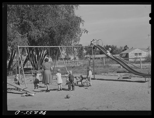 Children playing at the nursery school at the FSA (Farm Security Administration) farm family migratory labor camp. Yakima, Washington