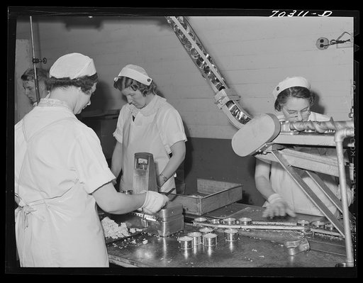 Weighing cans of tuna fish in Columbia River Packing Association. Astoria, Oregon