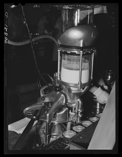 Putting salt into cans of tuna fish. Columbia River Packing Association. Astoria, Oregon