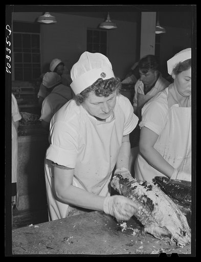 Skinning cooked tuna before canning. Columbia River Packing Association, Astoria, Oregon