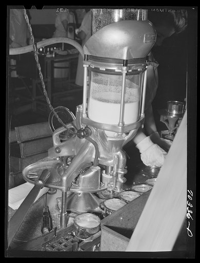 Machine which adds salt to can of salmon. Columbia River Packing Association, Astoria, Oregon