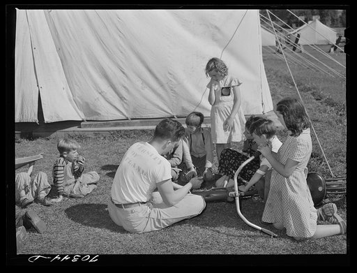Untitled photo, possibly related to: Repairing bicycle. FSA (Farm Security Administration) mobile camp for migratory farm workers. Odell, Oregon