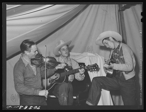 Untitled photo, possibly related to: Singing cowboy songs at entertainment at the FSA (Farm Security Administration) mobile camp for migratory farm workers. Odell, Oregon
