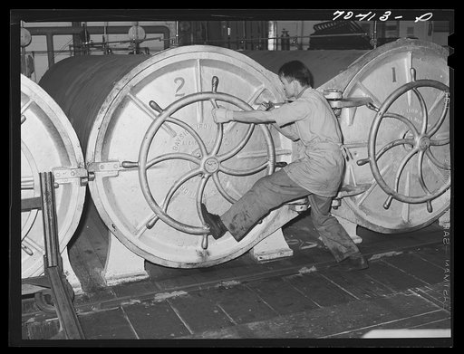 Untitled photo, possibly related to: Closing ovens in which canned salmon is cooked. Columbia River Packing Association, Astoria, Oregon