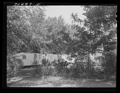 Untitled photo, possibly related to: Trailers occupied by workmen at the Umatilla ordnance depot parked around a house in a residential section of Hermiston, Oregon