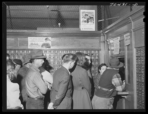Line up at general delivery window in the post office at Hermiston, Oregon. This post office served about eight hundred people a year ago, now it has more than five thousand general delivery patrons