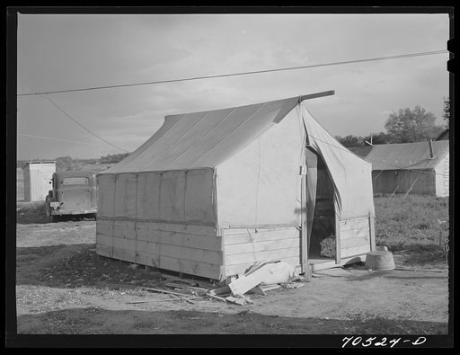 Tent of a workman and his family. Umatilla ordnance depot, Hermiston, Oregon. Tents with a bedspring in them rent for two dollars a night