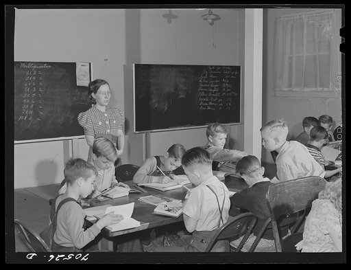 Untitled photo, possibly related to: School in basement of church. Hermiston, Oregon. The school board didn't have adequate buses for transportation of all the children of workmen at Umatilla ordnance depot and consequently many did not attend school