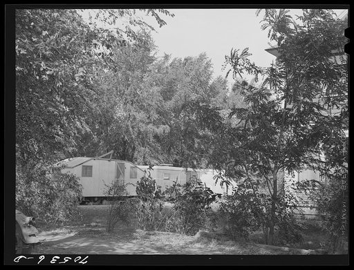 Trailers occupied by workmen at the Umatilla ordnance depot parked around a house in a residential section of Hermiston, Oregon