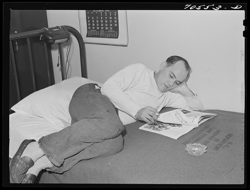 Workman at Navy shipyards, Bremerton, Washington in his room at the FSA (Farm Security Administration) dormitories