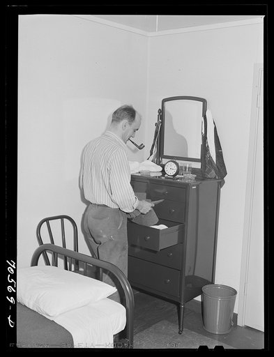 Workman at the Navy shipyards, Bremerton, Washington, in his room at the FSA (Farm Security Administration) duration dormitories. Bremerton, Washington