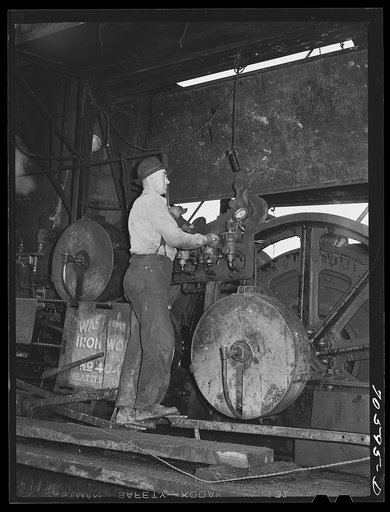 Long Bell Lumber Company, Cowlitz County, Washington. Donkey puncher on a steam-driven donkey which provides power for moving logs in process of yarding