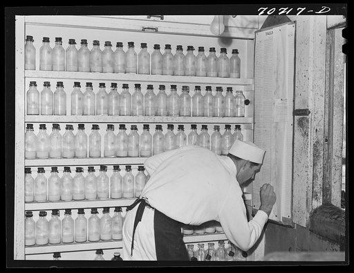 Samples of milk. Tillamook cheese plant, Tillamook, Oregon. Each dairyman's milk is tested twice a month at the cheese plant. Average butter fat content for last year was above 4.4 percent