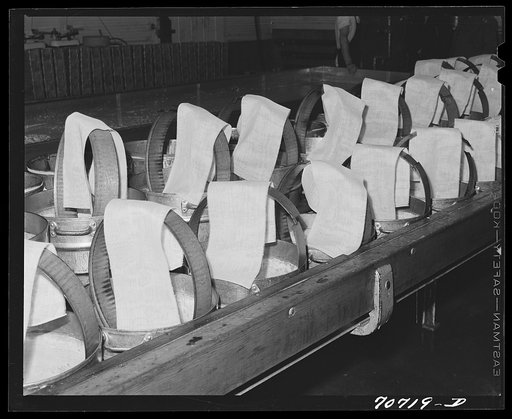 Untitled photo, possibly related to: Cheesecloth on molds, in which the cheese will be pressed. Tillamook cheese plant, Tillamook County, Oregon
