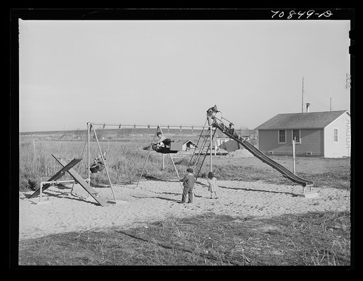 Children at play at the FSA (Farm Security Administration) camp for farm families. Caldwell, Idaho