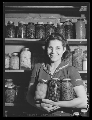 Mrs. Lee Wagoner with home canned fruits and vegetables. She and her husband farm on the Black Canyon Project. Canyon County, Idaho