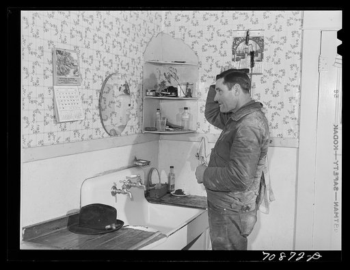Lee Wagoner, farmer on Black Canyon Project, washes up for dinner. Canyon County, Idaho