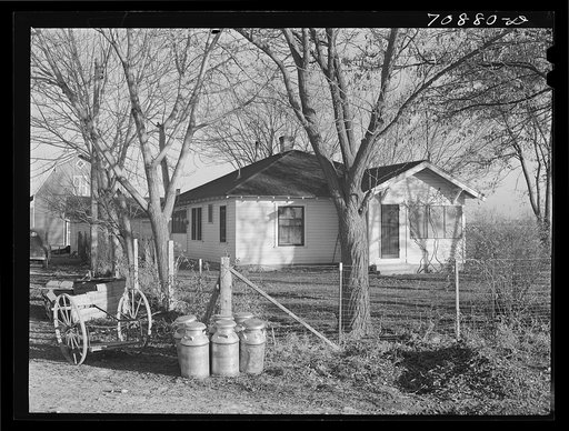 Farmhouse with milk cans waiting for creamery wagon. Canyon County, Idaho