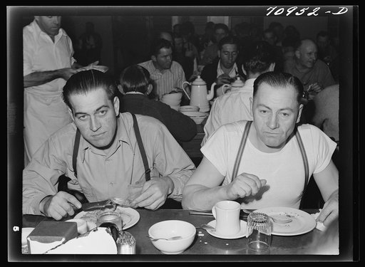 Workmen at Shasta Dam eating dinner at the commissary. Shasta County, California