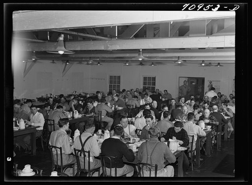 Workmen at Shasta Dam eating dinner at the commissary. Shasta County, California