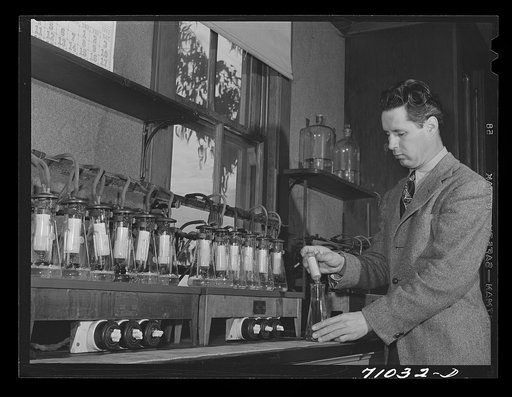 Salinas, California. Head chemist at the Intercontinental Rubber Producers experimenting on the deresination of guayule rubber