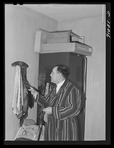 Vallejo, California. Workman at Mare Island shipbuilding yards in his room at FSA (Farm Security Administration) dormitories