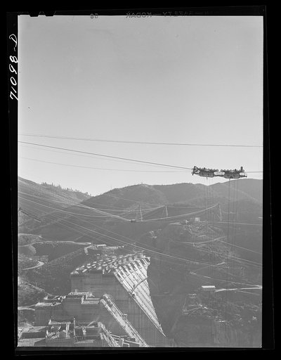 Shasta Dam under construction. The many cables are for transporting materials. Shasta County, California