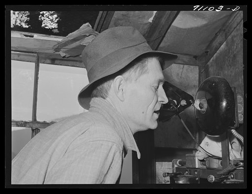 Untitled photo, possibly related to: Man in control tower at Shasta Dam. Shasta County, California. He directs the various cable cars, equiptment which transports materials to construction points
