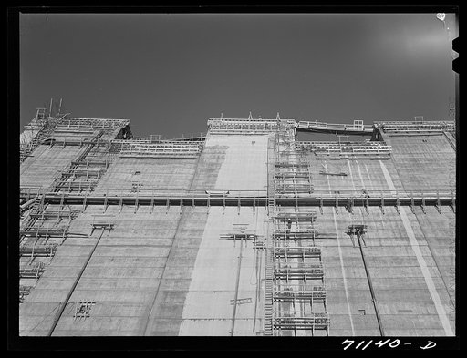 Looking up the face of Shasta Dam, under construction. Shasta County, California