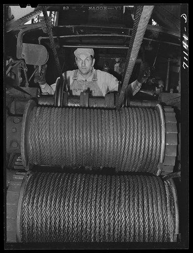 Untitled photo, possibly related to: Tending the cables on which cable cars run to transport materials in construction of Shasta Dam. Shasta County, California