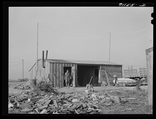Mr. Palmer is living here while he builds his new house, made possible through a FSA (Farm Security Administration) real estate loan. Black Canyon Project, Canyon County, Idaho