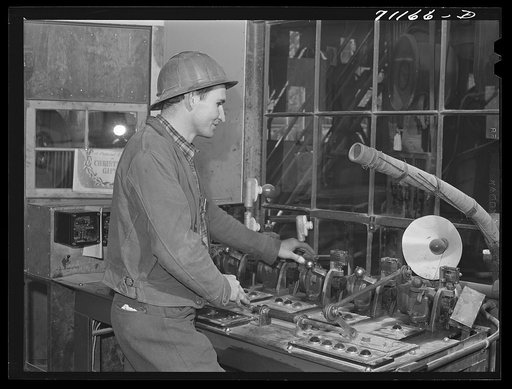 Worker who measures material going into concrete. Shasta Dam, Shasta County, California