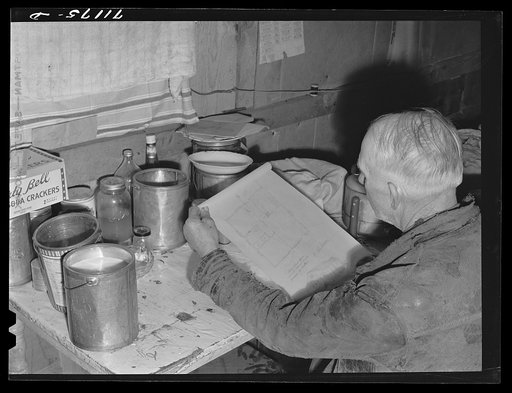 Mr. Palmer, who has a FSA (Farm Security Administration) real estate loan, looks over plans for his new house. Black Canyon Project, Canyon County, Idaho